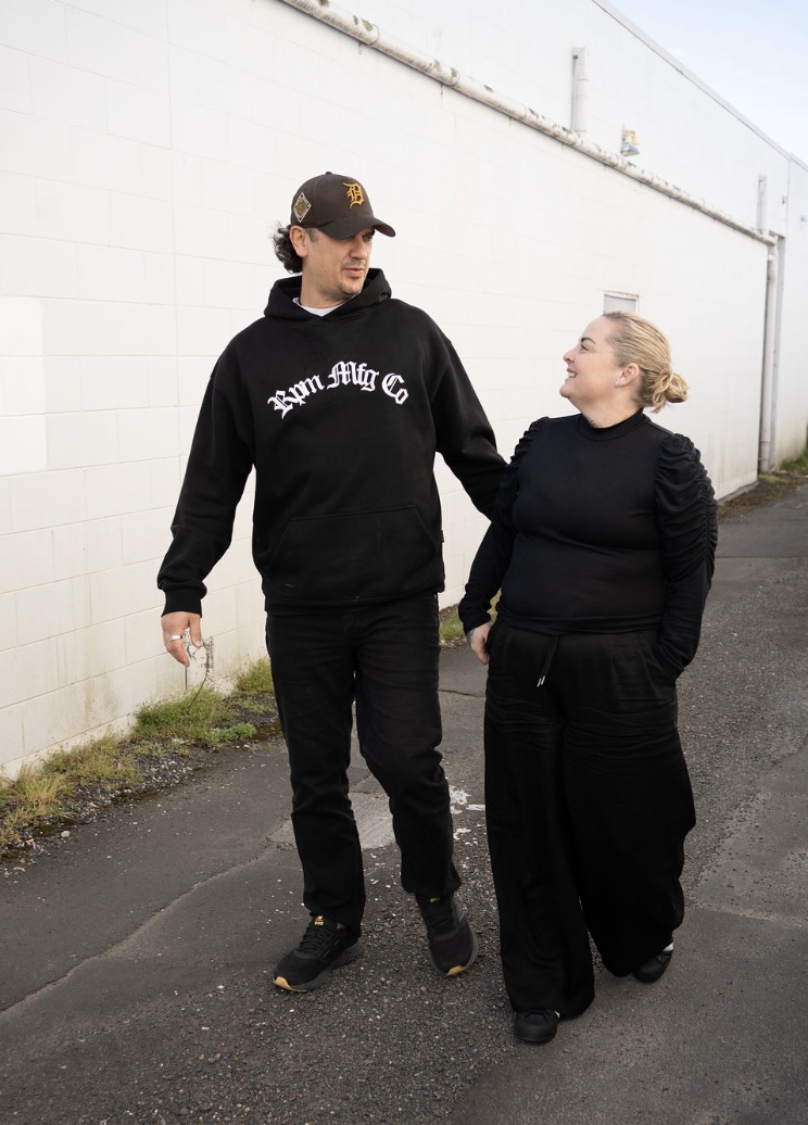 Cody Wharerau and Lisa Booth walking together, looking at each other